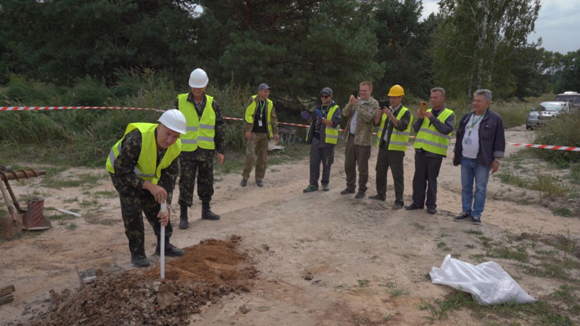 Andrew Niemczyk, inventor and president of Exlterra, installs the last of his NSPS tubes at the Chernobyl test site